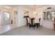 Dining area with table, chairs, and a china cabinet at 756 Avenida Estancia # 162, Venice, FL 34292