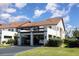 Attractive townhouse showcasing convenient parking, mature landscaping, and a peaceful neighborhood ambiance at 756 Avenida Estancia # 162, Venice, FL 34292
