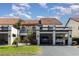 Inviting two-story condo featuring open carport and verdant landscaping at 756 Avenida Estancia # 162, Venice, FL 34292