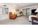 Cozy living room with a display cabinet, comfortable seating, and sliding glass doors at 756 Avenida Estancia # 162, Venice, FL 34292