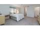 This is a well-lit bedroom featuring a soft carpet and bright walls at 756 Avenida Estancia # 162, Venice, FL 34292