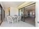 Patio with floral seating overlooking living room at 756 Avenida Estancia # 162, Venice, FL 34292