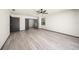 A bedroom with neutral walls and floors and a window allowing natural light at 7677 Saddle Creek Trl, Sarasota, FL 34241
