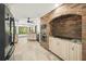 Spacious kitchen with brick oven area, custom cabinets, granite countertops and updated appliances at 7677 Saddle Creek Trl, Sarasota, FL 34241