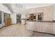 Spacious kitchen with granite countertops, light wood cabinets, and a functional layout at 7677 Saddle Creek Trl, Sarasota, FL 34241