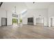 Bright and airy living room with high ceilings, large windows, and modern built-ins at 7677 Saddle Creek Trl, Sarasota, FL 34241