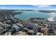 A beautiful view of the bay from above shows sailboats in the clear blue water and downtown buildings at 7767 Pine Trace Dr, Sarasota, FL 34243