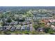 Aerial view of the community showcasing beautiful homes near a golf course, lakes, and lush landscaping at 7767 Pine Trace Dr, Sarasota, FL 34243