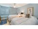 Charming bedroom features two twin beds, neutral decor and a window for natural light at 7767 Pine Trace Dr, Sarasota, FL 34243