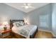 Bedroom with ceiling fan and hardwood floors at 7767 Pine Trace Dr, Sarasota, FL 34243