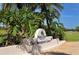 An inviting entrance to Palm-Aire Country Club, The Champions Course, surrounded by lush greenery at 7767 Pine Trace Dr, Sarasota, FL 34243