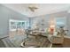 Inviting living room features stylish decor, comfortable seating, and seamless access to the outdoor living space at 7767 Pine Trace Dr, Sarasota, FL 34243