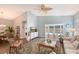 Comfortable living room with wood floors and access to the pool, perfect for relaxing and entertaining at 7767 Pine Trace Dr, Sarasota, FL 34243