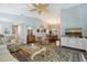 Bright and airy living room with a comfortable seating arrangement, modern entertainment setup, and tasteful decor throughout at 7767 Pine Trace Dr, Sarasota, FL 34243
