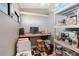 Home office has shelves, cabinets, and a window at 7767 Pine Trace Dr, Sarasota, FL 34243