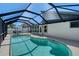 Inviting screened-in pool and patio area perfect for outdoor relaxation and entertaining at 7767 Pine Trace Dr, Sarasota, FL 34243