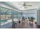 Cozy sunroom with a pool view that offers a peaceful escape and seamless indoor-outdoor living at 7767 Pine Trace Dr, Sarasota, FL 34243