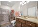 Bathroom with a walk-in shower, wood vanity, and neutral tile flooring at 7959 Limestone Ln # 14-104, Sarasota, FL 34233