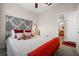 Bedroom featuring a decorative headboard, and an ensuite bathroom with a granite-topped vanity at 7959 Limestone Ln # 14-104, Sarasota, FL 34233
