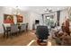 Open-concept living and dining area with tile floors and sliding door access to the outdoors at 7959 Limestone Ln # 14-104, Sarasota, FL 34233