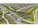 Aerial view of the community's gated entrance, water features, well-manicured landscaping, and single-Gathering homes at 8108 Wild Blue Ter, Sarasota, FL 34241