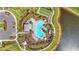 Aerial view of community pool and spa with lounge chairs, cabanas, tropical landscaping, parking, and a tennis court at 8108 Wild Blue Ter, Sarasota, FL 34241