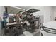 Well-organized garage with two golf carts, storage shelves, and epoxy-coated flooring at 8108 Wild Blue Ter, Sarasota, FL 34241