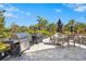 Outdoor grilling area with stainless steel grills and seating for outdoor dining at 8108 Wild Blue Ter, Sarasota, FL 34241