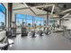 State-of-the-art gym with modern equipment and expansive windows offering stunning views of the neighborhood at 8108 Wild Blue Ter, Sarasota, FL 34241