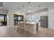 Kitchen with stainless steel appliances, large island, and barstool seating at 8108 Wild Blue Ter, Sarasota, FL 34241