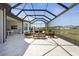 This screened lanai features ample seating and views of the lake, ideal for relaxation and outdoor entertaining at 8108 Wild Blue Ter, Sarasota, FL 34241