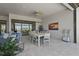 A well-designed lanai offers a comfortable space for outdoor dining and relaxation with scenic views at 8108 Wild Blue Ter, Sarasota, FL 34241