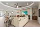 Open-concept living room with hardwood floors, recessed lighting, adjacent to dining area at 8108 Wild Blue Ter, Sarasota, FL 34241