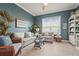 Cozy living room with stylish furniture, nautical decor, and hardwood flooring at 8108 Wild Blue Ter, Sarasota, FL 34241