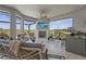 Outdoor living area with a fireplace, TV, kitchen, seating, and picturesque views at 8108 Wild Blue Ter, Sarasota, FL 34241