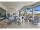 Outdoor living area featuring a seating area, ceiling fans, and picturesque views at 8108 Wild Blue Ter, Sarasota, FL 34241