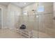 Contemporary shower with dual shower heads, glass enclosure, and tile surround at 8108 Wild Blue Ter, Sarasota, FL 34241