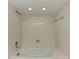 Enclosed shower and tub area featuring tiled walls and shower head at 835 S Osprey Ave # 101, Sarasota, FL 34236