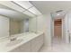 Bathroom featuring double sinks, large mirror, and combined shower and bathtub at 835 S Osprey Ave # 101, Sarasota, FL 34236