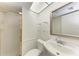 Cozy bathroom with gold trimmed shower, sink and mirror at 835 S Osprey Ave # 101, Sarasota, FL 34236