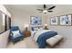 Decorated bedroom with blue accents, including a bed and reading chair at 835 S Osprey Ave # 101, Sarasota, FL 34236