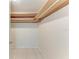 Walk-in closet with tiled floor and wooden shelving at 835 S Osprey Ave # 101, Sarasota, FL 34236