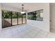 Bright dining room with sliding glass doors overlooking the balcony at 835 S Osprey Ave # 101, Sarasota, FL 34236