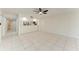 Open living area showcasing sleek tile floors and a breakfast bar at 835 S Osprey Ave # 101, Sarasota, FL 34236