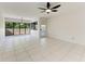 Bright living room with white tile flooring and natural light at 835 S Osprey Ave # 101, Sarasota, FL 34236