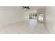 Bright living room with white tile flooring and natural light at 835 S Osprey Ave # 101, Sarasota, FL 34236