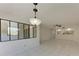 Open concept living room looking into dining area and kitchen at 835 S Osprey Ave # 101, Sarasota, FL 34236