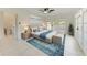 Bright main bedroom with a ceiling fan, access to a balcony, and ensuite at 835 S Osprey Ave # 101, Sarasota, FL 34236