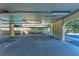 View of covered parking area and ample space for vehicles, complete with bright lighting fixtures at 835 S Osprey Ave # 101, Sarasota, FL 34236