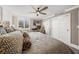 Relaxing bedroom features a ceiling fan, ample closet space, and a serene view, ensuring comfort and convenience at 101 Sunset Dr # 103, Sarasota, FL 34236